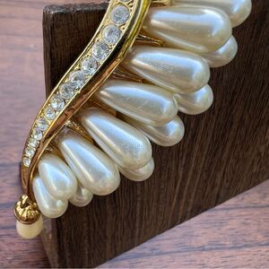 Faux pearl gold tone brooch with dangle accent